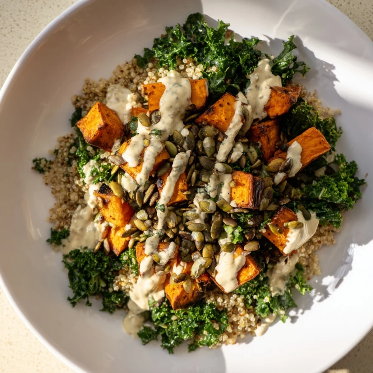 Enjoy a refreshing Light Coastal Bowl; savory roasted sweet potatoes, fluffy quinoa, and vibrant kale.