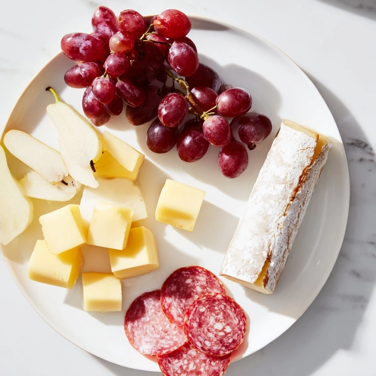 A beautifully arranged Twelve Days of Christmas snack board with colorful holiday treats for serving.
