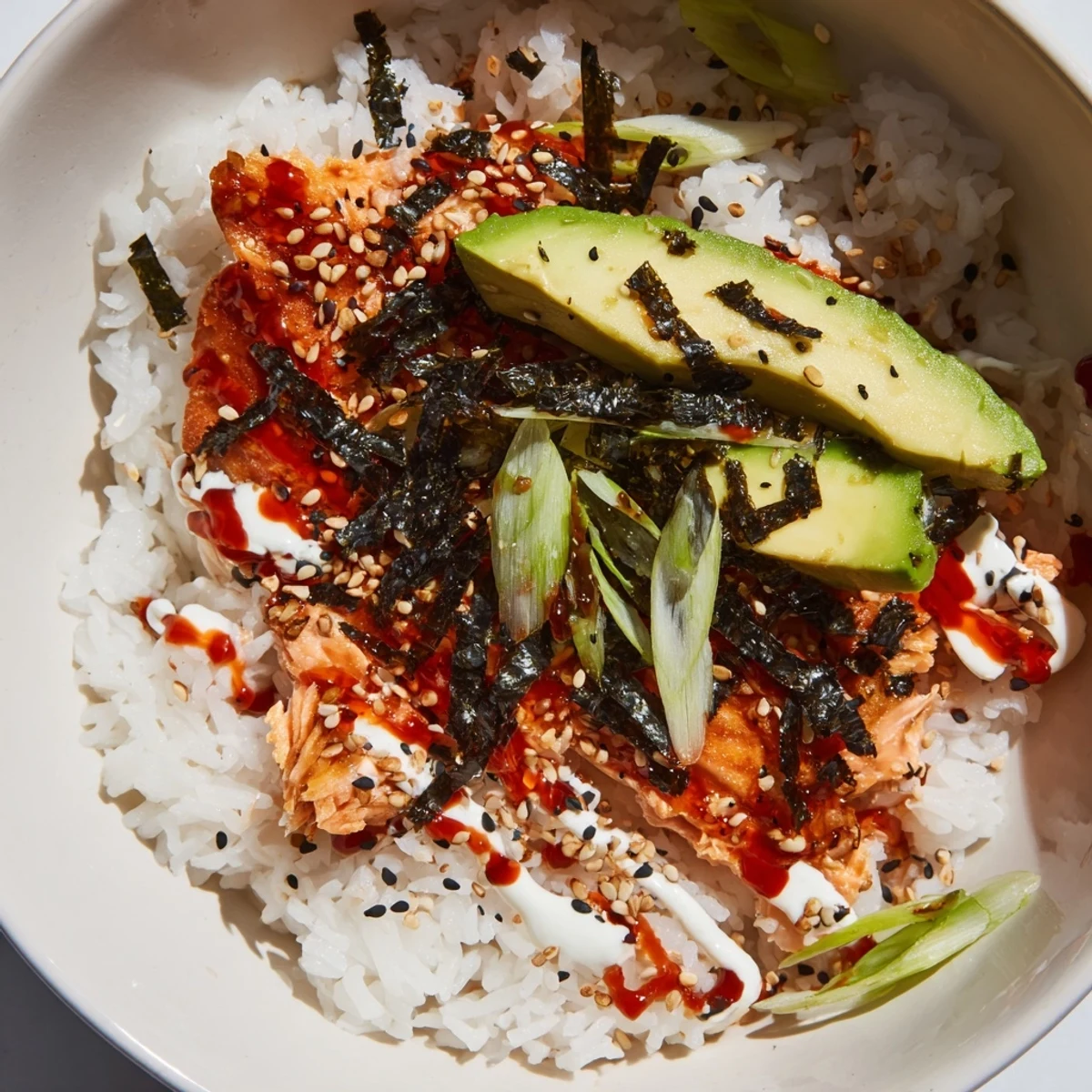 Classic Salmon Rice with creamy avocado slices, a delightful, easy Asian-inspired dinner.