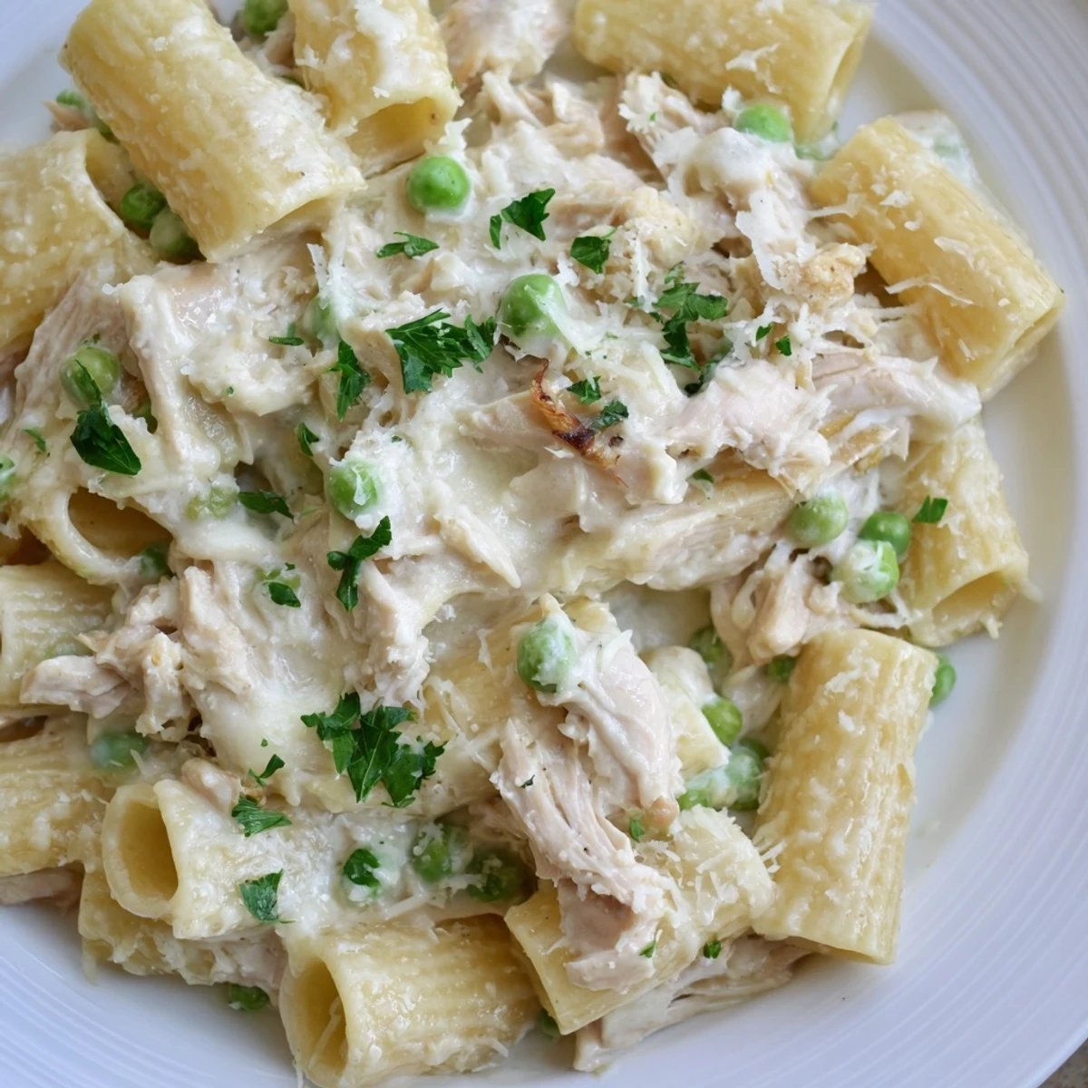 Creamy Slow Cooker Chicken Alfredo Pasta Bake with perfectly cooked pasta and tender chicken.