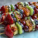 Vibrant Rainbow Fruit Skewers with Honey Dip: a refreshing medley of fresh fruit on skewers, served with a luscious, sweet honey-yogurt dip.