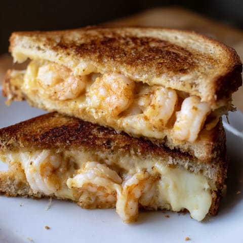 This Quick Shrimp Grilled Cheese shows off perfectly toasted sourdough with a seafood and cheese filling.