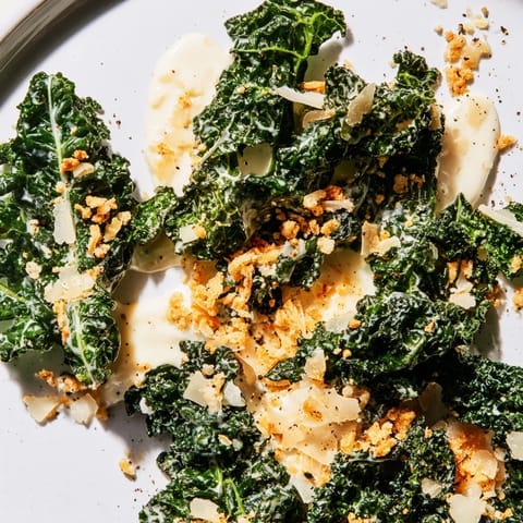 Massaged kale tossed in a creamy garlic Parmesan dressing, topped with golden toasted breadcrumbs and shaved Parmesan.  