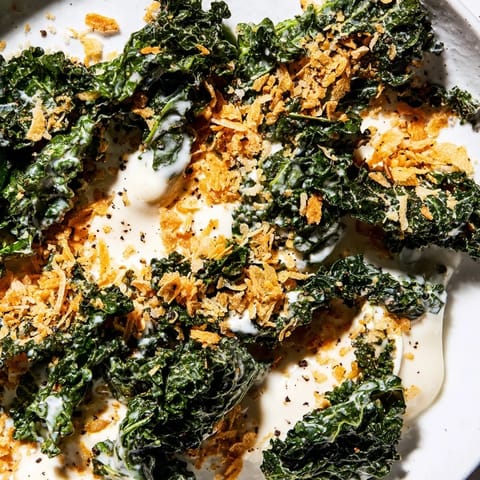 Garlic Parmesan Kale Salad served fresh with crunchy panko and a bright lemony finish, perfect for a light lunch.  