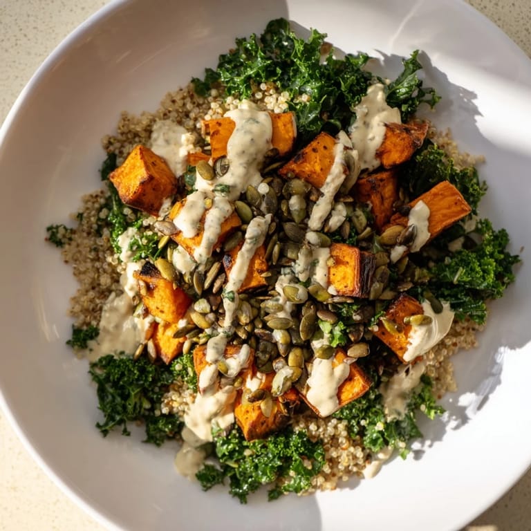 Enjoy a refreshing Light Coastal Bowl; savory roasted sweet potatoes, fluffy quinoa, and vibrant kale.