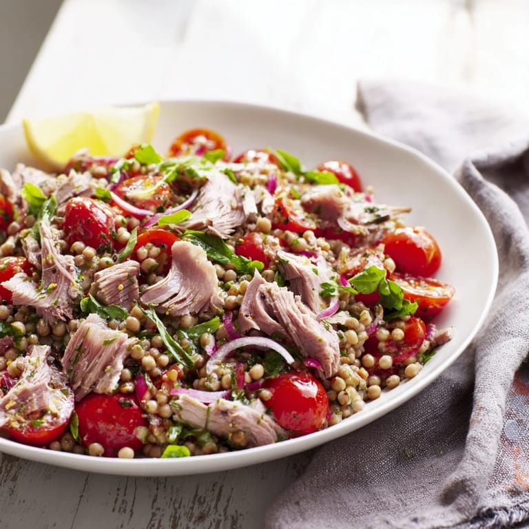 Flaky tuna and chunky chickpeas are tossed in lemon dressing for this delicious salad recipe.