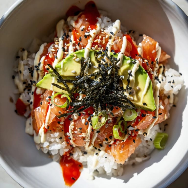 Flaky salmon mixed into warm Classic Salmon Rice, topped with sesame seeds for a satisfying, texturized bite.