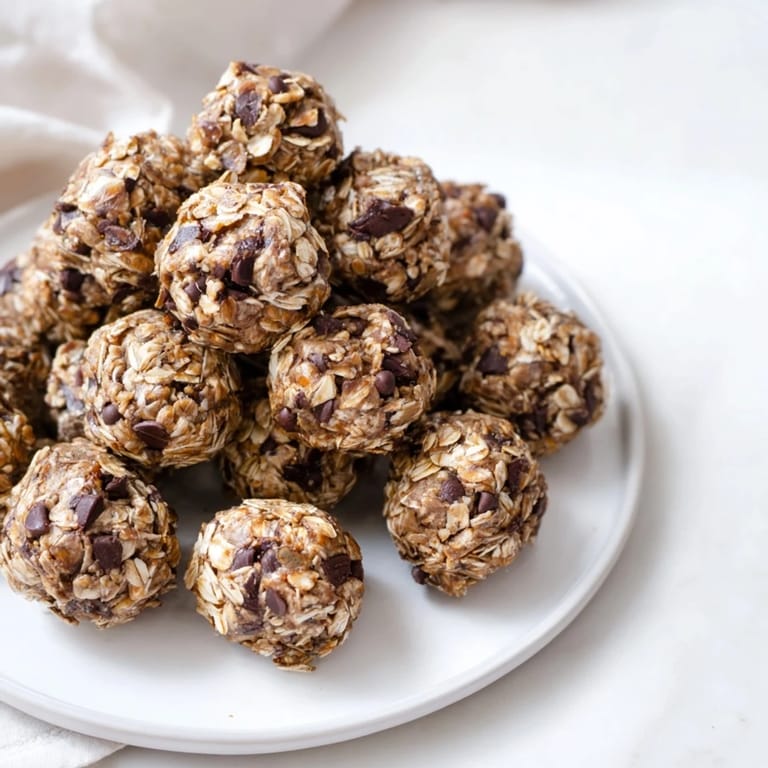 Homemade Banana Chocolate Chip Energy Balls in a glass jar, ready for on-the-go energy, featuring natural sweetness from ripe banana and nut butter.